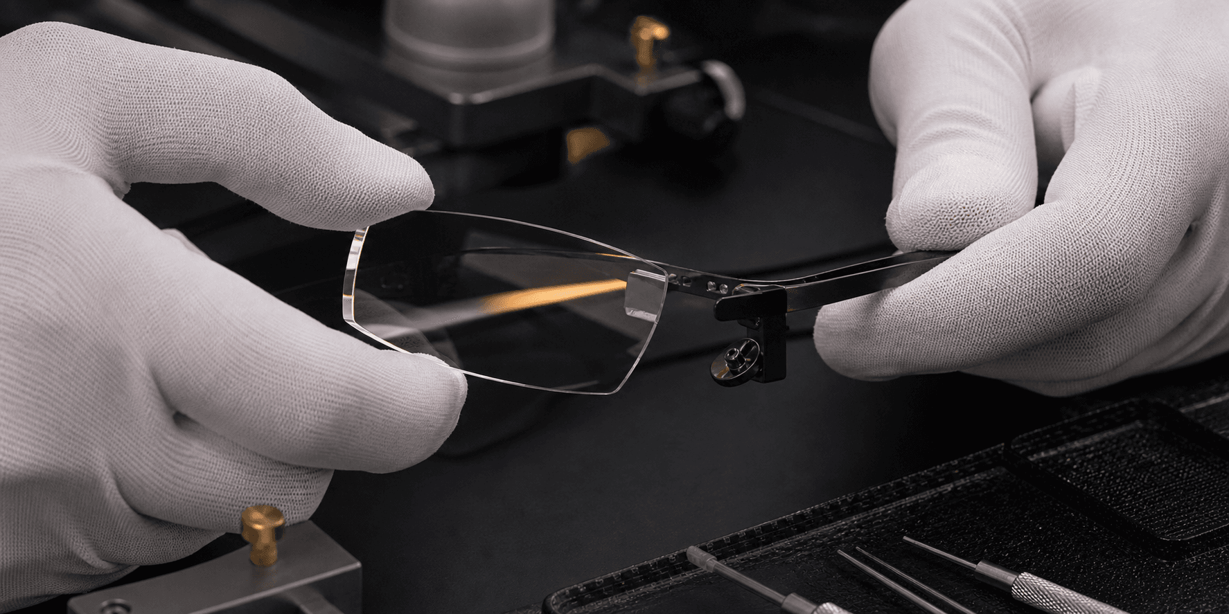 An engineer assembling the optical system of smart glasses